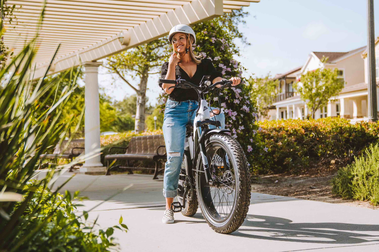 Woman under a gazebo riding an eBike