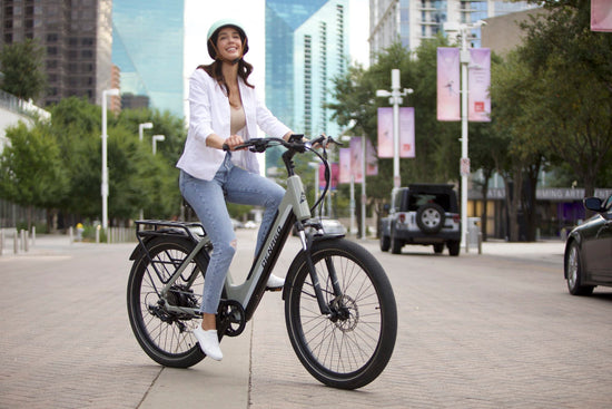 Woman riding Denago Commute Model 1 in downtown Dallas